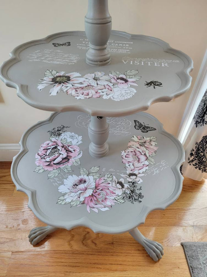 Close up of light gray painted tble with pink and white flowers