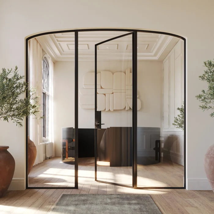 Modular steel door with mini arch top and integrated side glass.