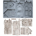 A set of miniature Victorian house templates and roof designs shown both assembled in gray and as unfolded paper/cardboard components on a white background. The text 'CHARLIE BAY LOND' and '10D' are visible on the gray assembled sheet.