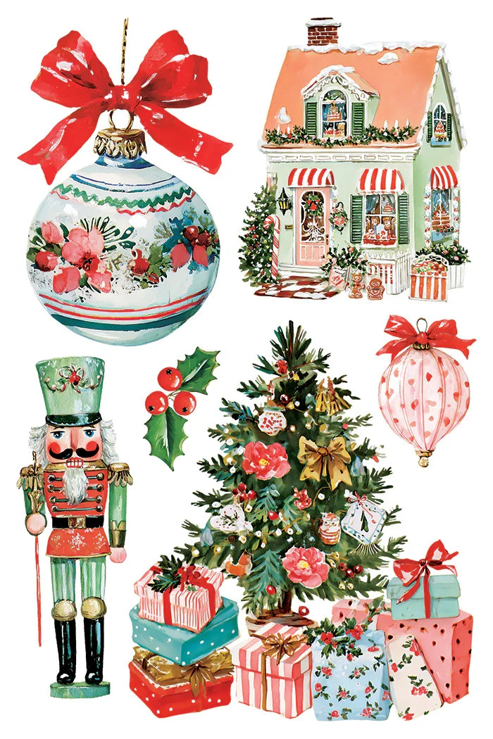 A collection of Christmas-themed clipart illustrations on a white background, including a large ornament with a red bow, a decorated house, a nutcracker, a Christmas tree with gifts, and a pink patterned hot air balloon.