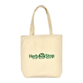 Beige tote bag with 'Herb Stop' logo on a white background