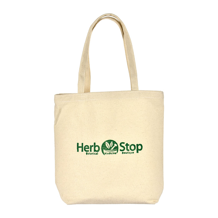 Beige tote bag with 'Herb Stop' logo on a white background