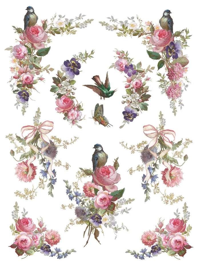 Decorative design with flowers, birds, and ribbons on a white background