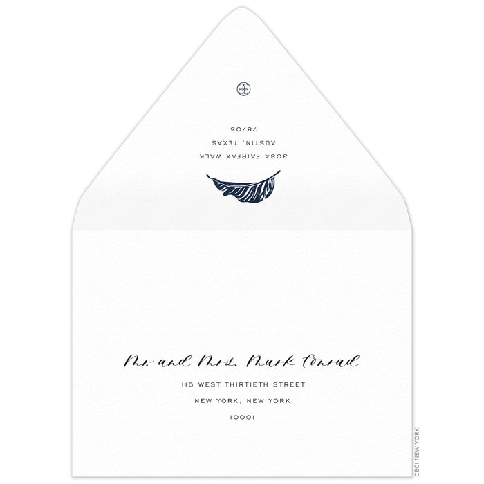 White envelope, san serif return address and modern palm leaf in navy on the back flap. Mailing address on the front of the envelope.