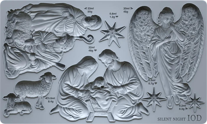 A silicone mold tray featuring multiple Christmas nativity and angel designs, including Mary, Joseph, baby Jesus, an angel, shepherds, and stars, with printed volume and weight measurements and the text 'SILENT NIGHT IOD' in the bottom right corner.