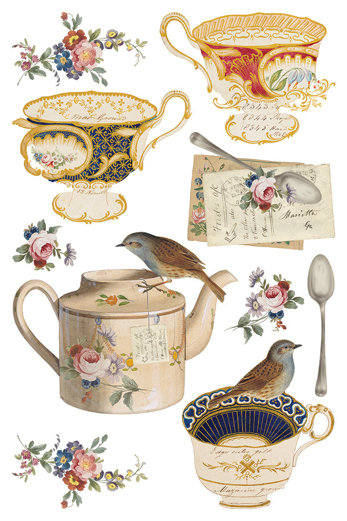Collection of decorative teacups, teapot, birds, and floral elements on a white background